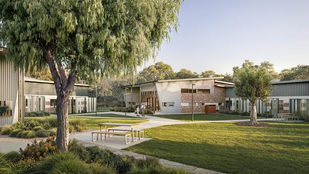 Single-storey modern accommodation building and courtyard.