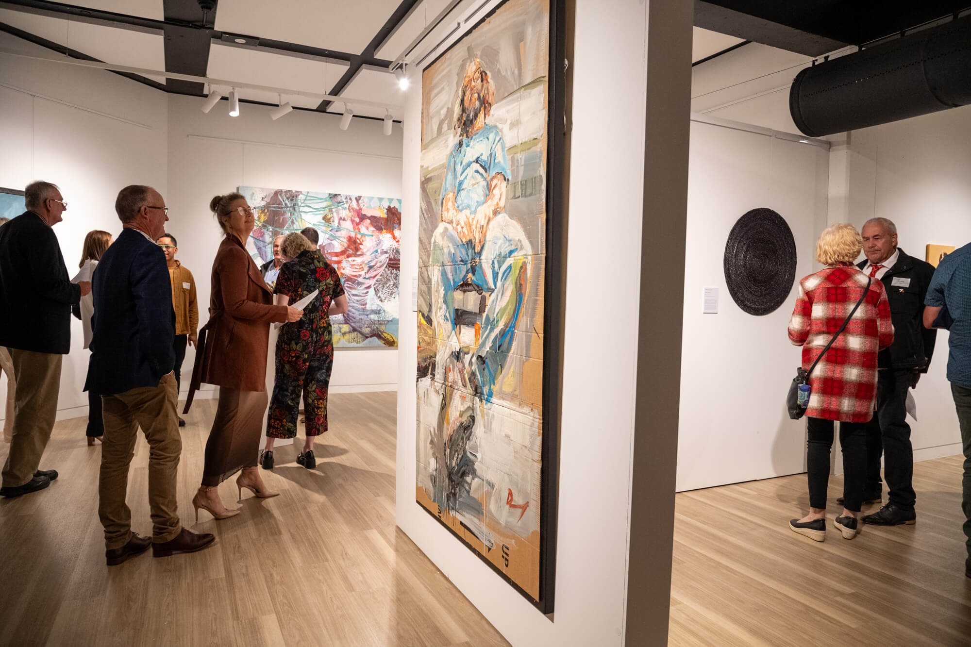 People viewing Biennial Art Award artwork at the UniSQ Art Gallery, Toowoomba.