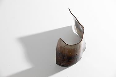 Bird's eye view of a sculpture from the art exhibit Black Soil, by Peter Osborn.