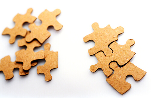 brown jigsaw pieces on a white background