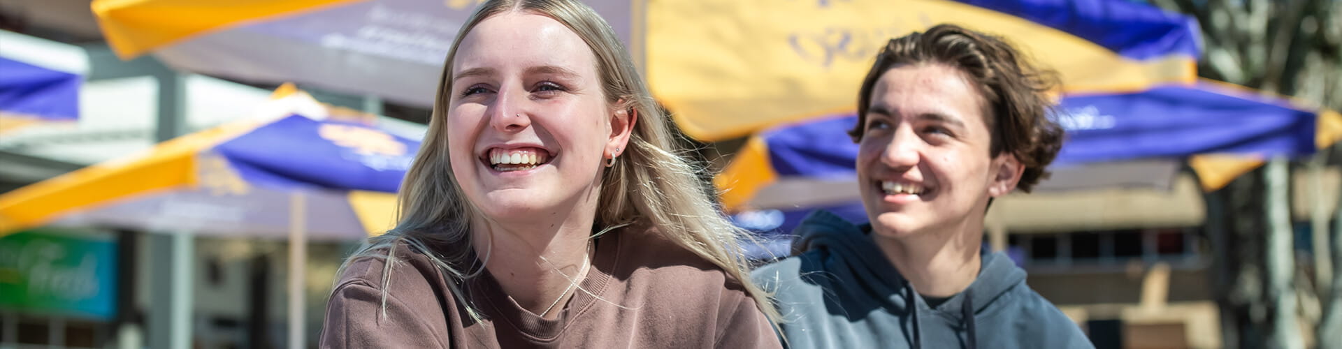 Two students sitting at the UniSQ Toowoomba campus.