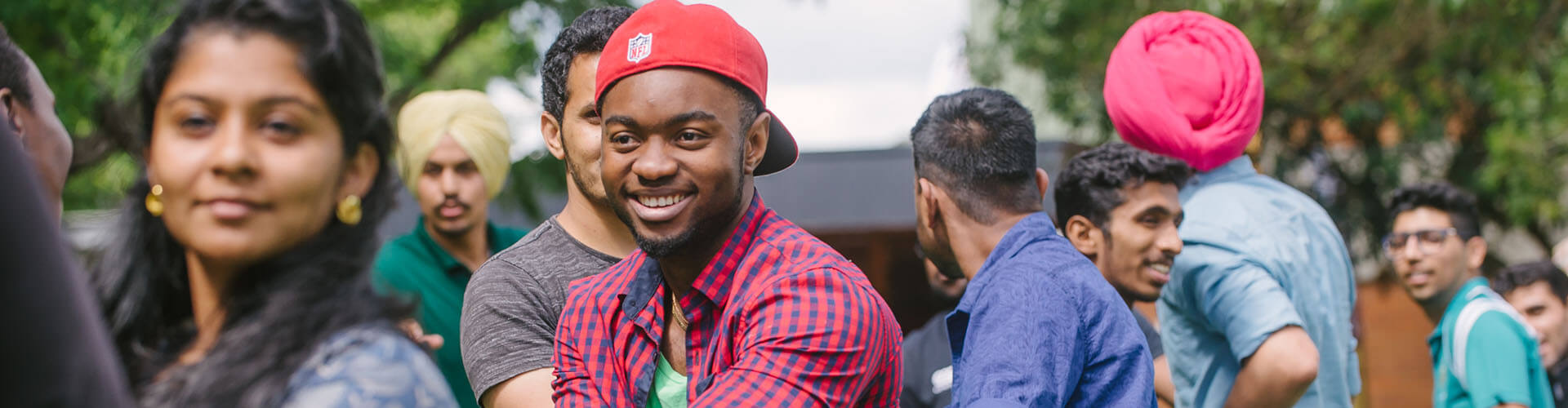 People from different cultures smiling.