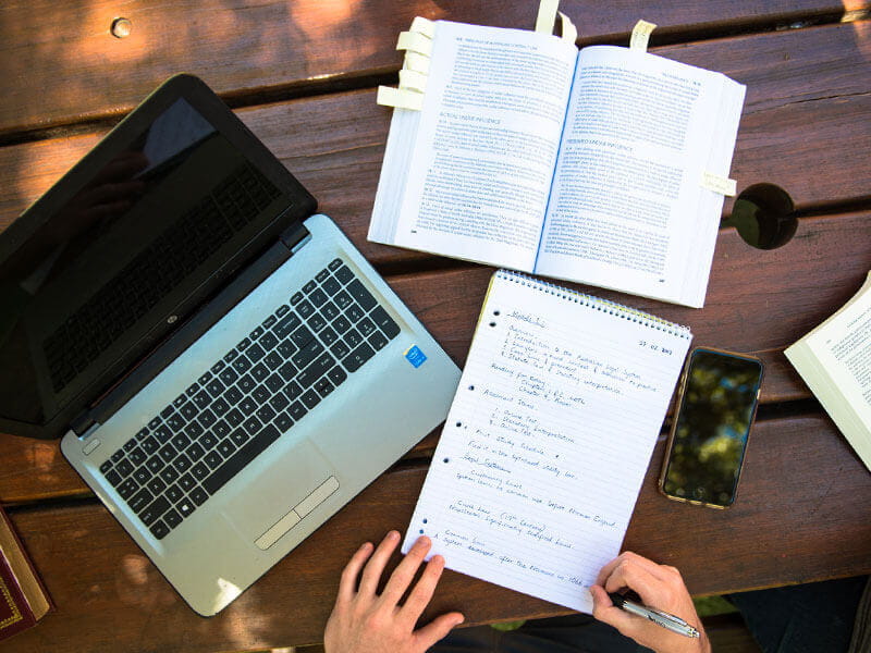 open books and laptop on a table