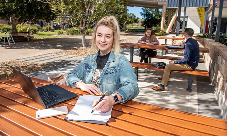 Girl studying outside. 
