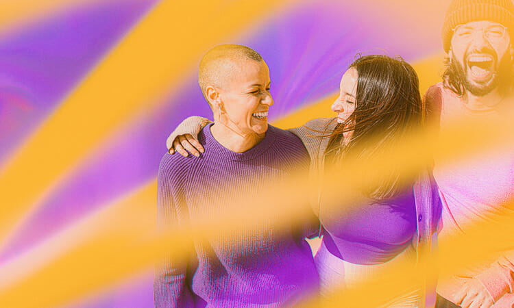 Three people laughing and smiling among vibrant yellow and purple light streaks.