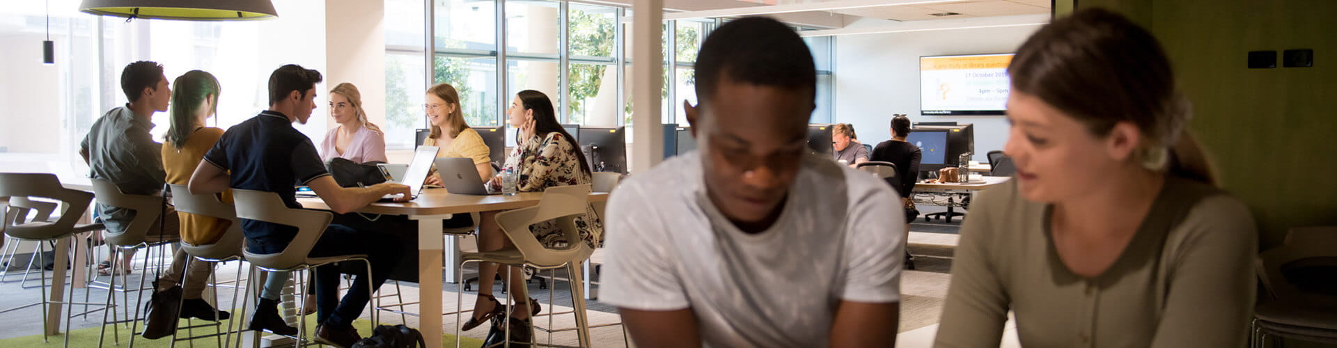 Two students studying in the Library at UniSQ Springfield.