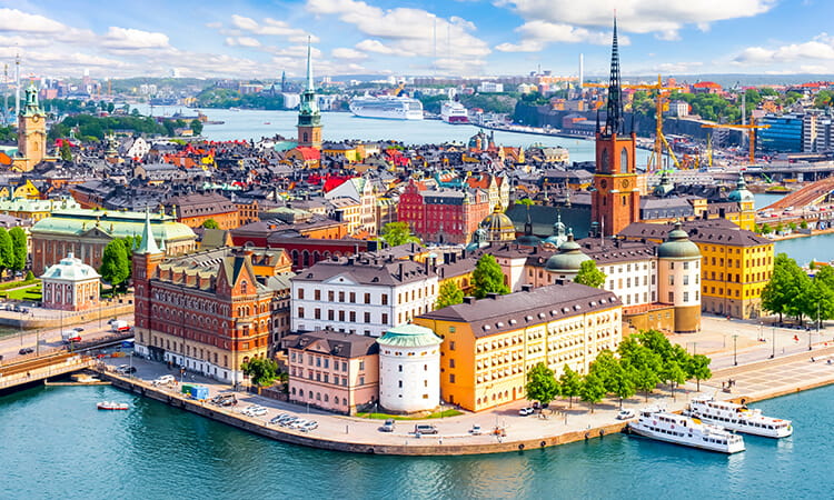 Aerial view of Stockholm's cityscape with historic buildings and waterways.