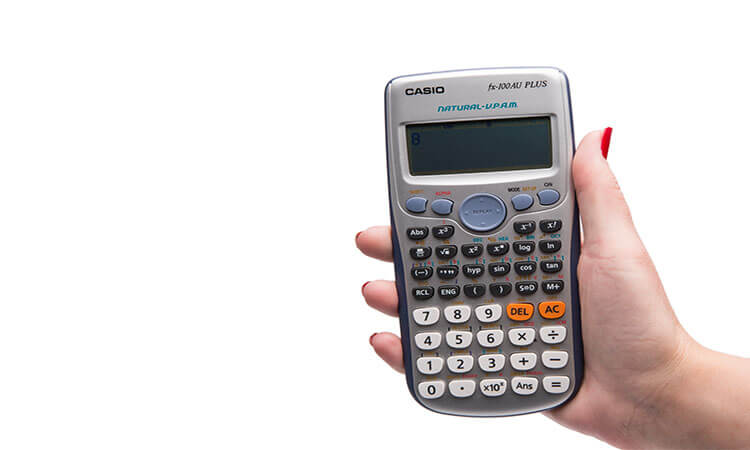 Person holding a scientific calculator