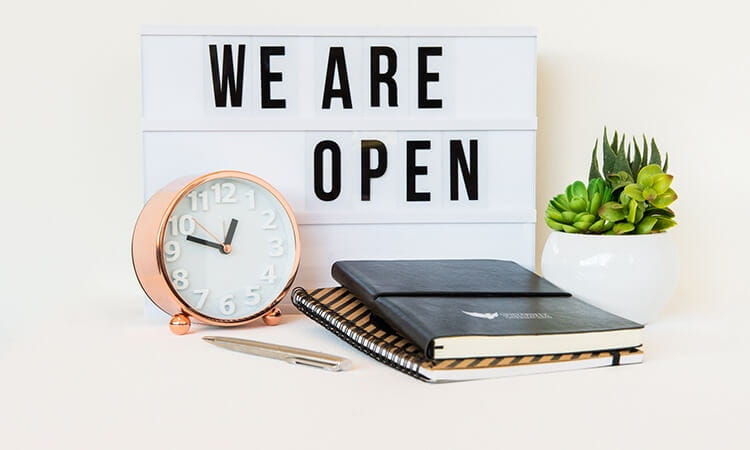 Welcome sign indicating the business is open