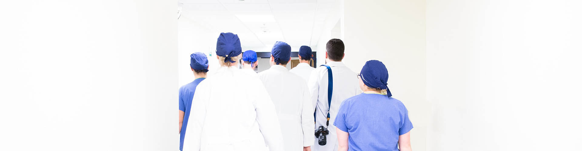 nurses walking down a hallway