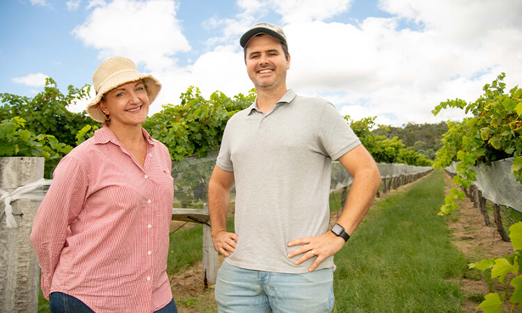 man and woman in vineyard