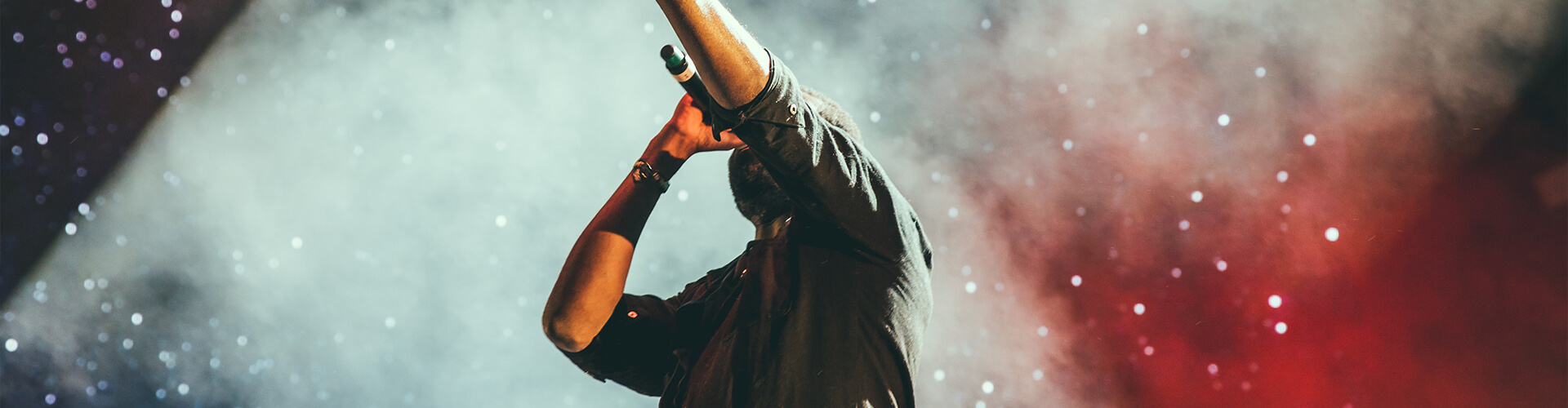Man singing on stage.