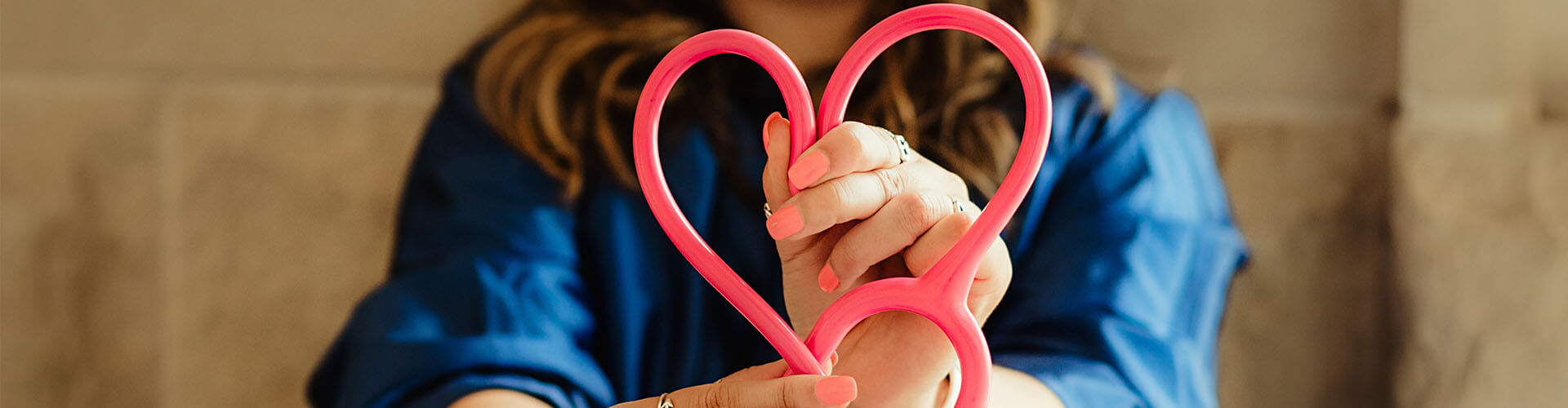 nurse holding a love heart 