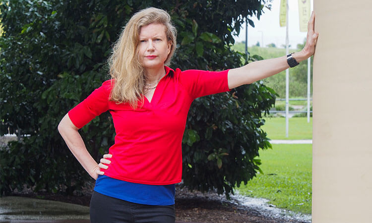 woman standing with hand on hip