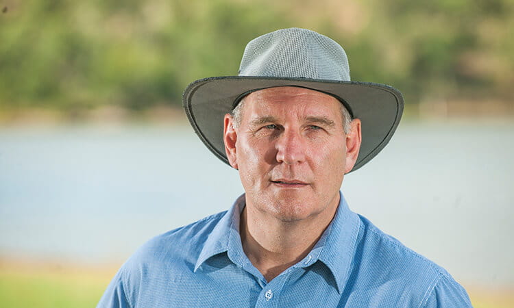 man with hat smiling 