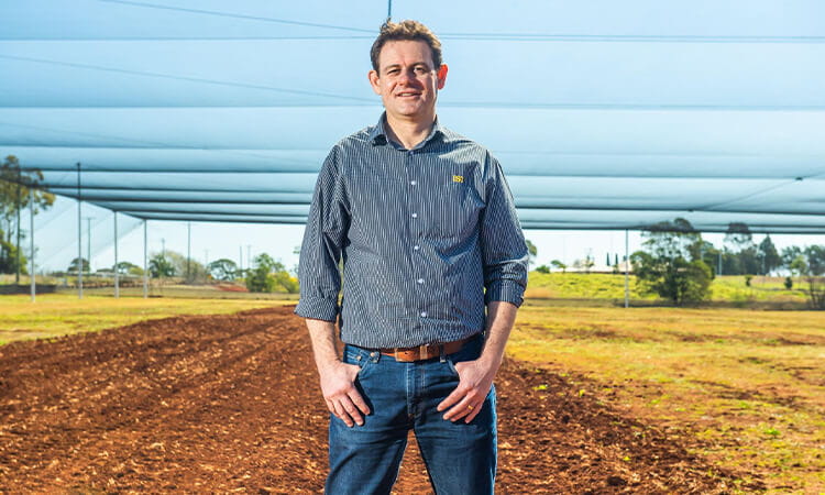 Man standing in crop.