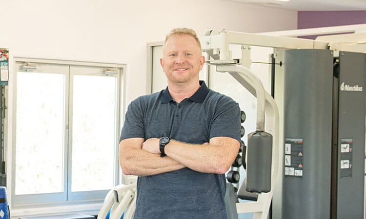Man standing in gym