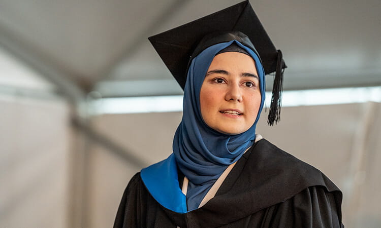 Graduate smiling.