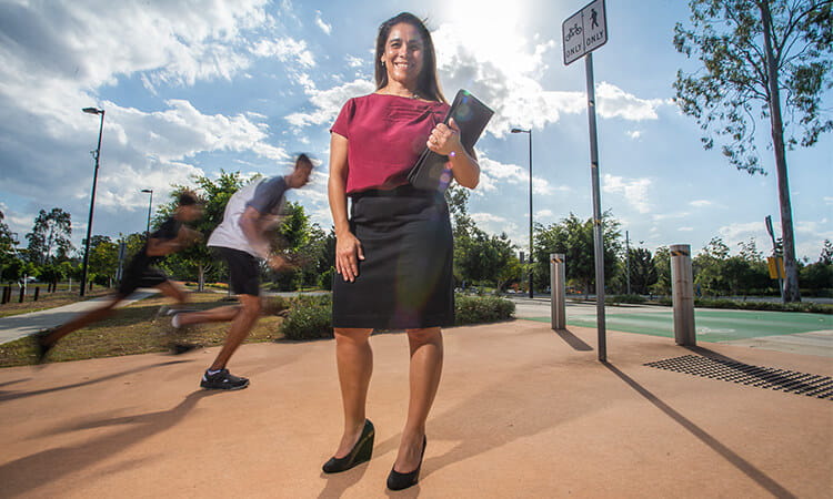 woman standing on running path