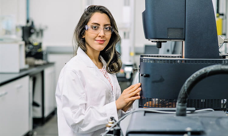 Woman holding machine.