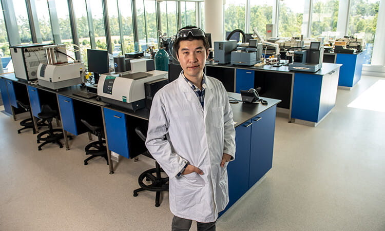 man in lab coat smiling