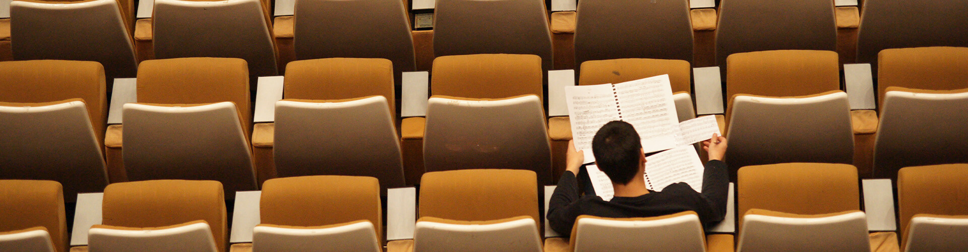 student in theatre studying 