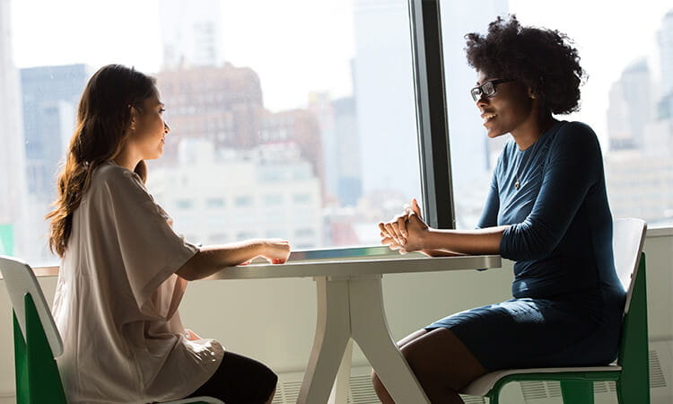 people talking at a table 