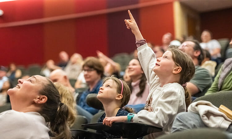 curious kids in the audience 