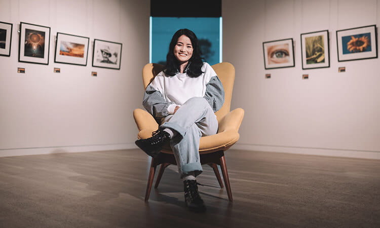 girl smiling in a chair