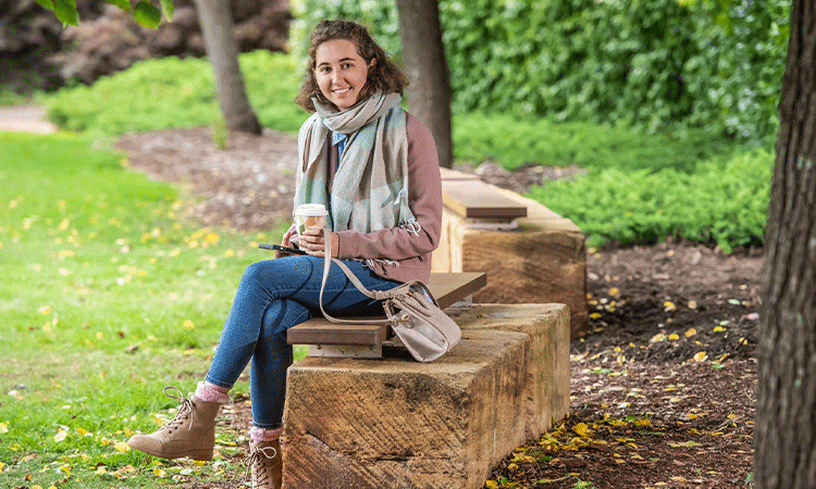 Woman sitting outside.