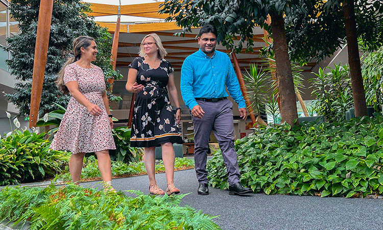 Three people walking.