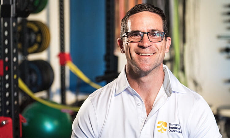 man smiling in the gym