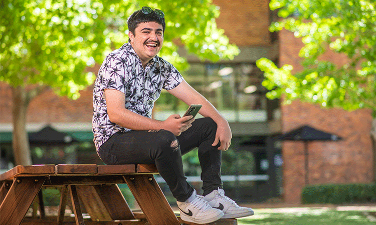 Man sitting on bench.