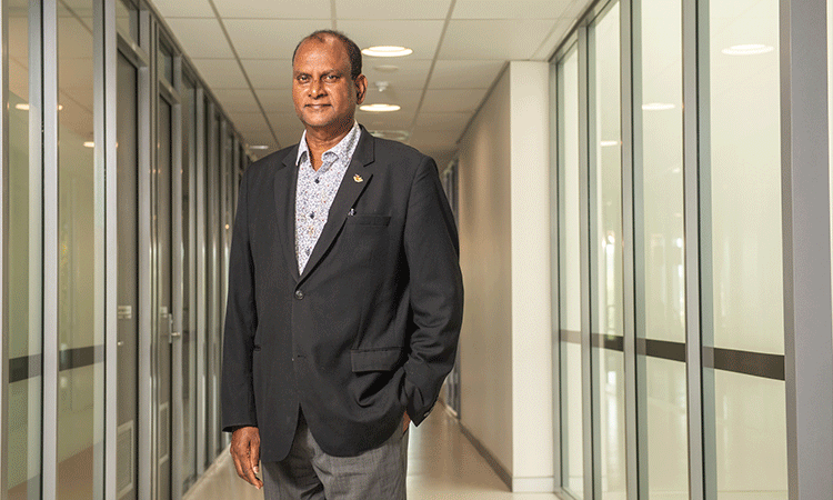 Man standing in hallway.