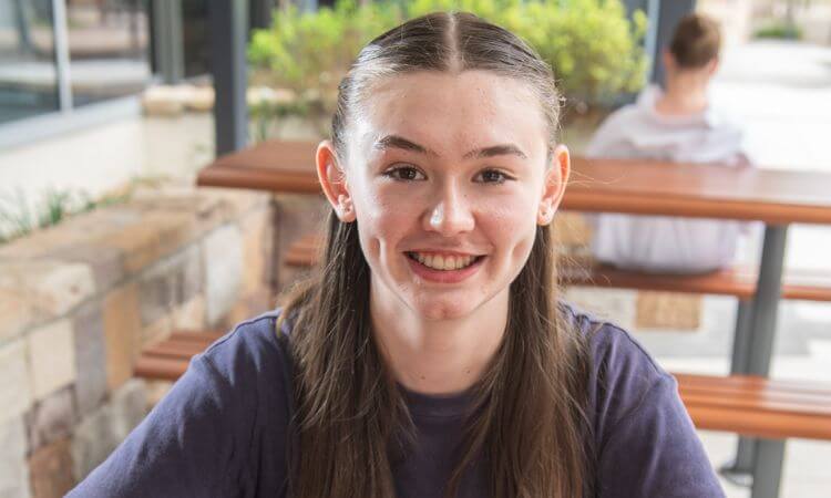 girl at university smiling 