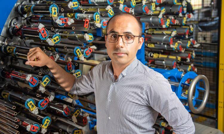 man standing in front of machine