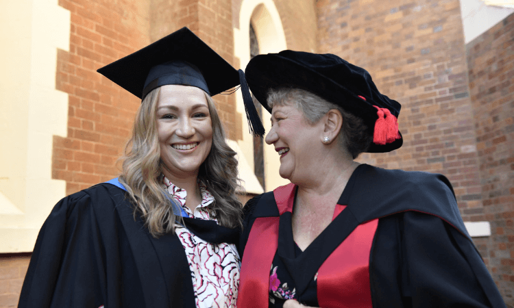 Mother and Daughter graduates.