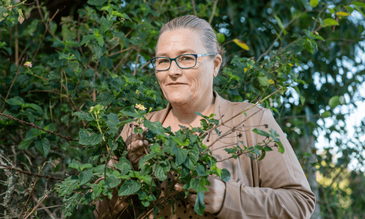 Woman with plants.