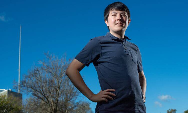man standing with sky behind him 