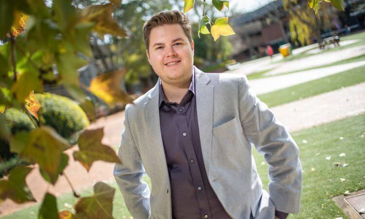 man smiling in a suit 