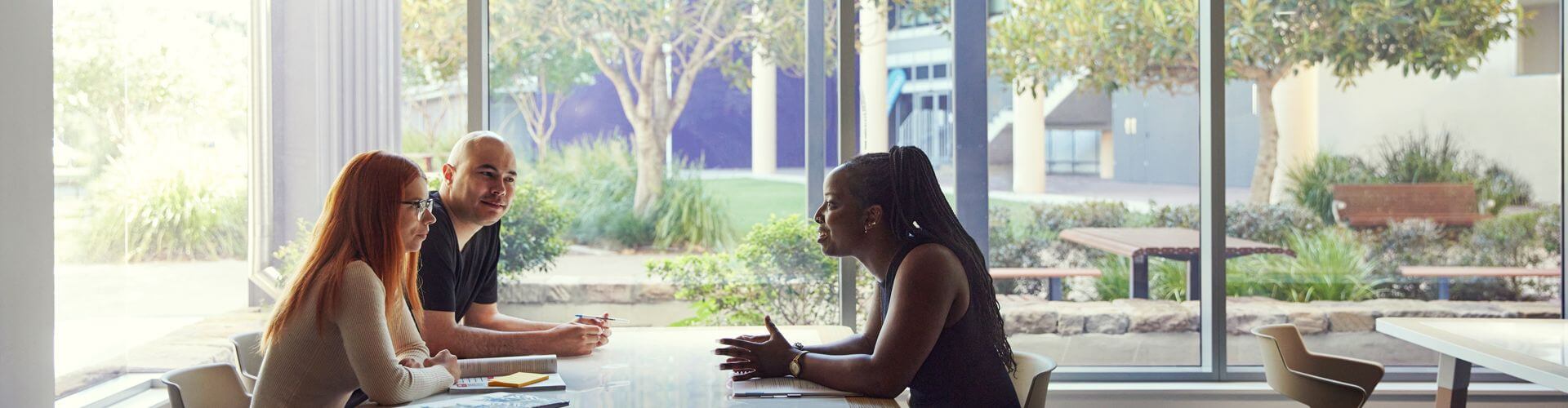 students talking in the library