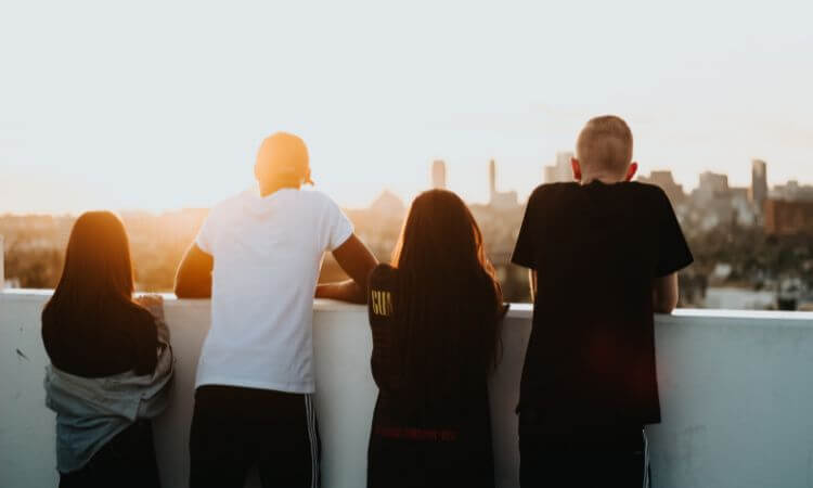 youth looking out over a sunset