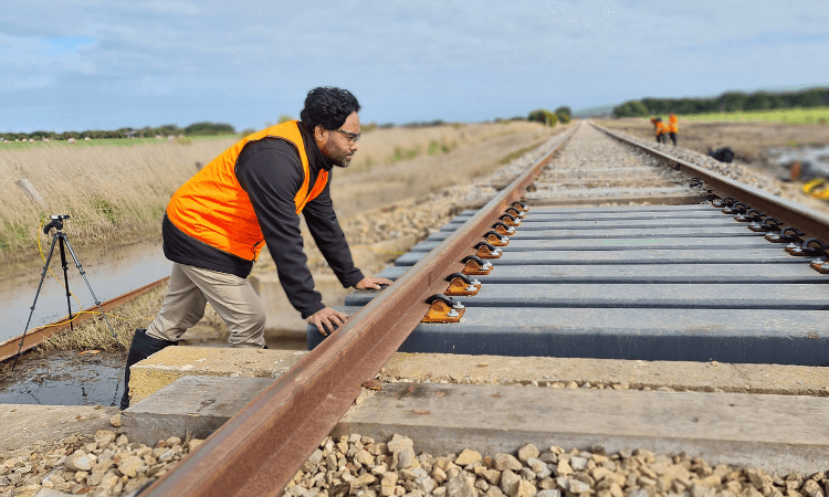 Researcher on train tracks.