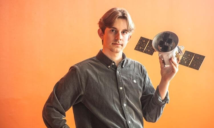 man holding research space object