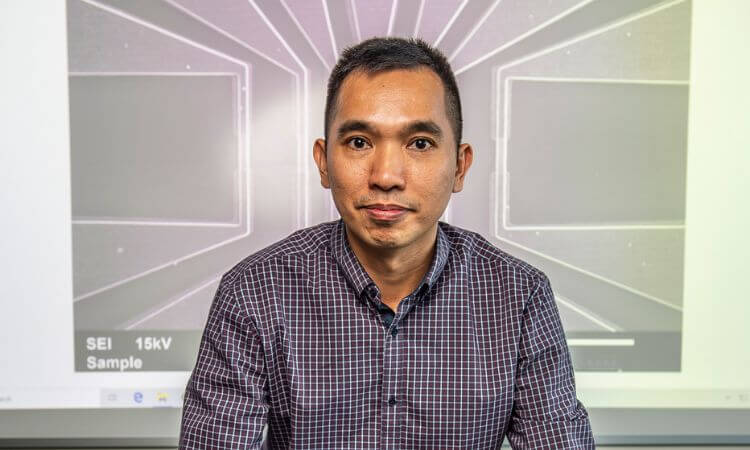 man standing in front of screen 