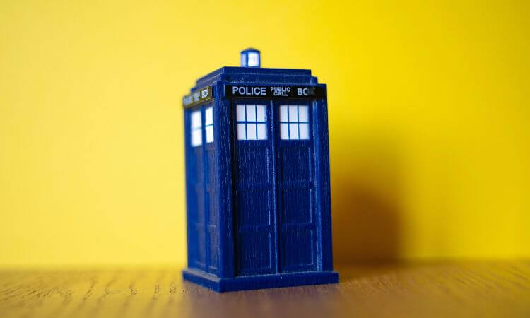 dr who telephone booth with yellow background 