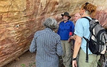 UniSQ archaeologists observing historical rock art
