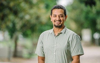 UniSQ ICT student standing on campus