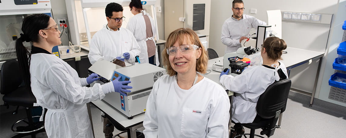 Team of scientists working in a laboratory setting.