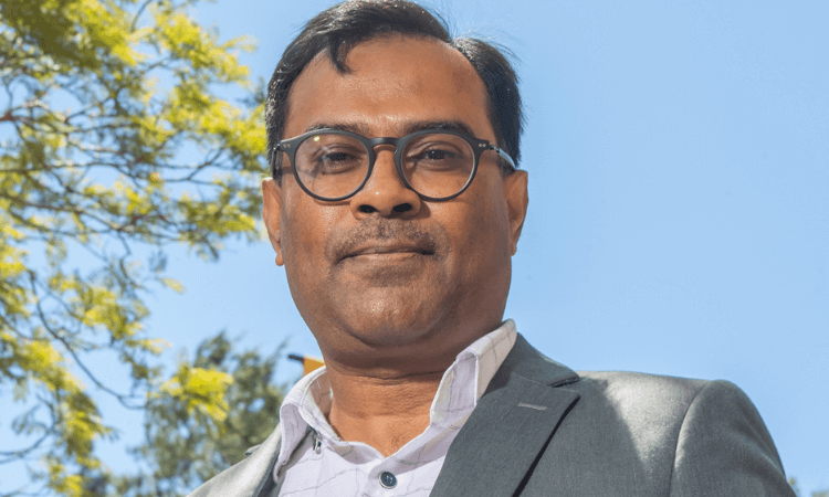 a man smiling at the camera